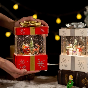 Red Christmas snow globe music box with Santa Claus and LED lights in gift box shape