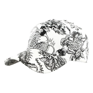 Unisex baseball cap featuring dense black and white floral print and curved brim