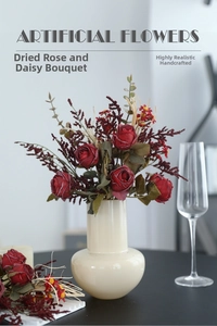 Retro burnt-edge roses and daisies bouquet in a matte ceramic vase for table decor