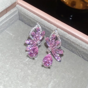 Macro shot of pink zircon butterfly earrings featuring marquise and teardrop stones