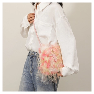 Detail of pink gradient faux fur shoulder bag with slender strap and metal buckle