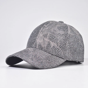Detail of dark grey baseball cap featuring full rhinestone animal print and curved brim