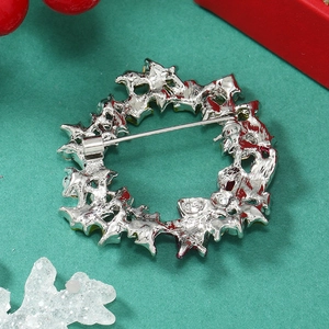 Detailed back view of a silver wreath brooch with secure pin clasp for Christmas
