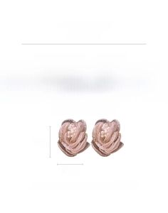 Detail view of pink fabric rose earrings with pearl center and silver needle hook