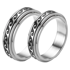 Minimalist spinning stainless steel rings with engraved ocean wave patterns for stress relief