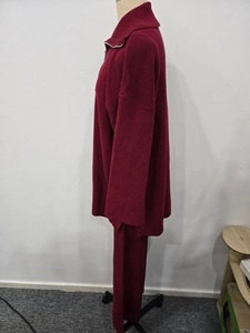 Detailed side view of burgundy knit set showing the half-zip collar and ribbed texture