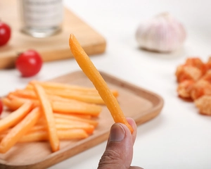 Close-up of a realistic PVC artificial chicken wing model with crispy texture detail
