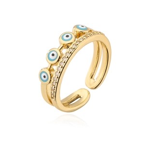 Detail of 18K gold plated multi-layer evil eye ring with blue enamel and zircon inlay