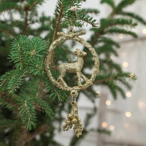 Golden glitter reindeer resin ornament hanging on a festive Christmas tree