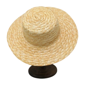 Detailed close-up of finely woven straw sun hat on a wooden stand with wide brim detail