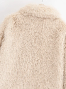 Close-up of fluffy faux fur texture in light beige with soft high-quality fibers
