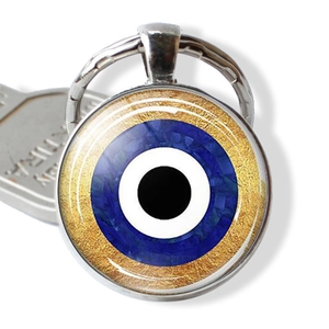 Blue Evil Eye keychain pendant with gold textured background and metal key ring