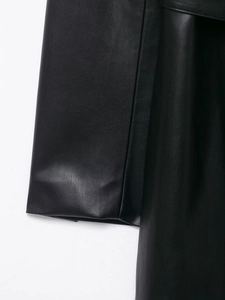 Detailed close-up of high-quality black faux leather sleeve stitching and texture