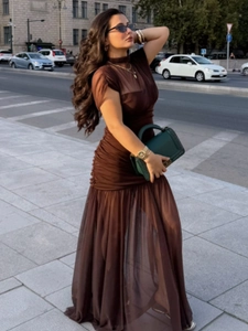 Deep brown mesh sleeveless dress featuring elegant ruched waist and layered maxi hemline