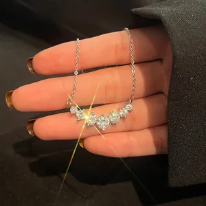 Macro shot of 925 silver necklace with seven brilliant-cut moissanite stones