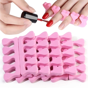 Pink EVA foam nail separators in a large set used for professional pedicure and manicure