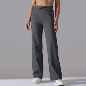 Detail view of high waist drawstring and side pockets on dark grey wide leg yoga pants