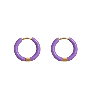 Detail shot of purple enamel hoop earrings with 18K gold plated stainless steel accents
