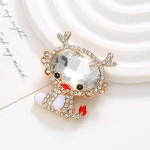 Detail of a gold alloy dragon charm with clear crystals and red enamel for DIY phone cases
