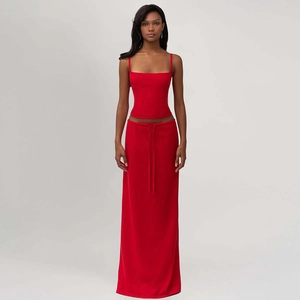 Detailed view of the red two-piece set featuring a cropped tank top and a long maxi skirt