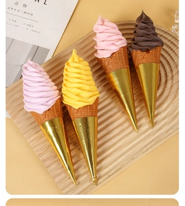 Top view of four colorful artificial ice cream cones on a wooden tray for display