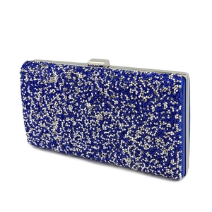 Detailed macro view of the sparkling blue and silver rhinestones on the evening clutch bag