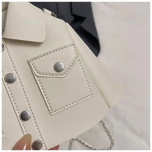 Detail of jacket-shaped off-white crossbody bag with silver buttons and chain strap