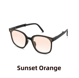 Detail view of sunset orange gradient lenses with stylish black frames on foldable sunglasses