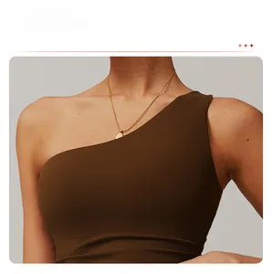 Detail of dark brown sports vest featuring unique one-shoulder asymmetric design