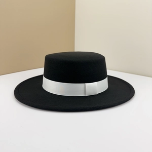 Classic black wool felt boater hat with a contrasting white ribbon band decoration.
