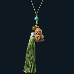 Handcrafted green sandalwood hollow gourd pendant with long green tassel and beads