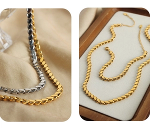 Detail of leaf-shaped chain in gold and silver finish with secure lobster clasp