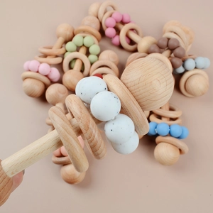 Beech wood and silicone baby rattle with colorful teething beads for sensory play