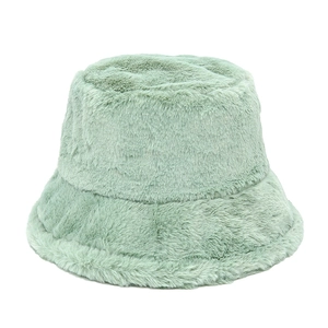 Detail view of the soft faux fur texture and mint green plush finish of this bucket hat