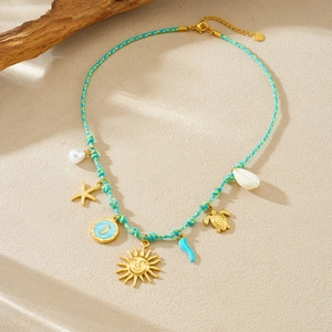 Bohemian gold plated sun moon starfish and turtle pendant necklace on teal woven rope