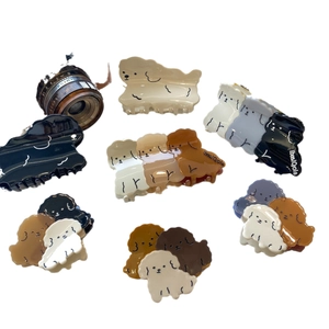 Cute acetate poodle hair claws in assorted colors including black brown and beige sets