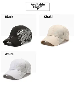 Detail of dragon print design on six-panel baseball caps in black, khaki and white