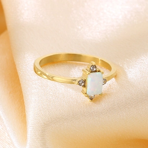 Minimalist gold titanium steel ring with rectangular white opal and zircon accents