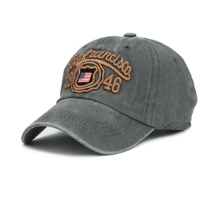 Macro detail of San Francisco 46 embroidery on a gray washed cotton baseball cap
