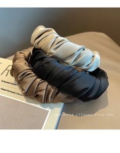 Three-piece set of wide pleated satin headbands in champagne gold, black, and brown