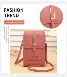 Detail of coral pink PU leather phone bag with gold U-shaped buckle and dual zippers