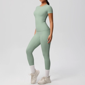 Detail of sage green yoga set showing side pocket design and high-stretch fabric texture