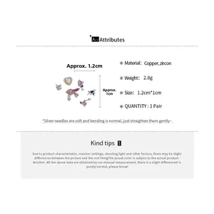 Detailed view of silver needle heart stud earrings with pink and purple zircon stones