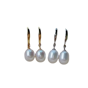 Elegant freshwater rice pearl hook earrings in gold and silver finishes on white background