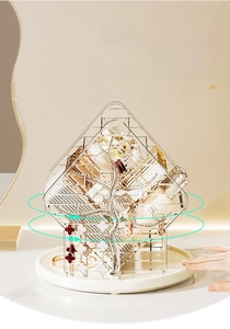 Close-up of 360-degree rotating vanity makeup organizer with golden metal tree hooks