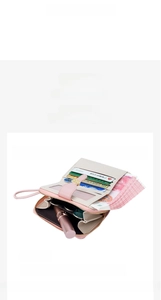 Pink and beige long wallet interior showing multiple card slots and cash compartments