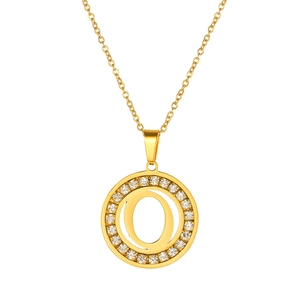 Detail of gold letter O necklace with double ring design and sparkling zircon pavé