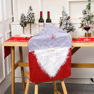 Festive Santa hat chair covers with plush gnome beard for holiday dining room decor