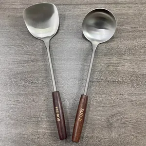 SUS 304 stainless steel spatula and soup ladle set with vintage wooden handles on wood background