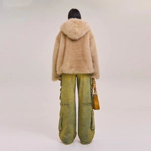 Back view of beige faux fur hoodie paired with multi-pocket cargo pants and leather bag